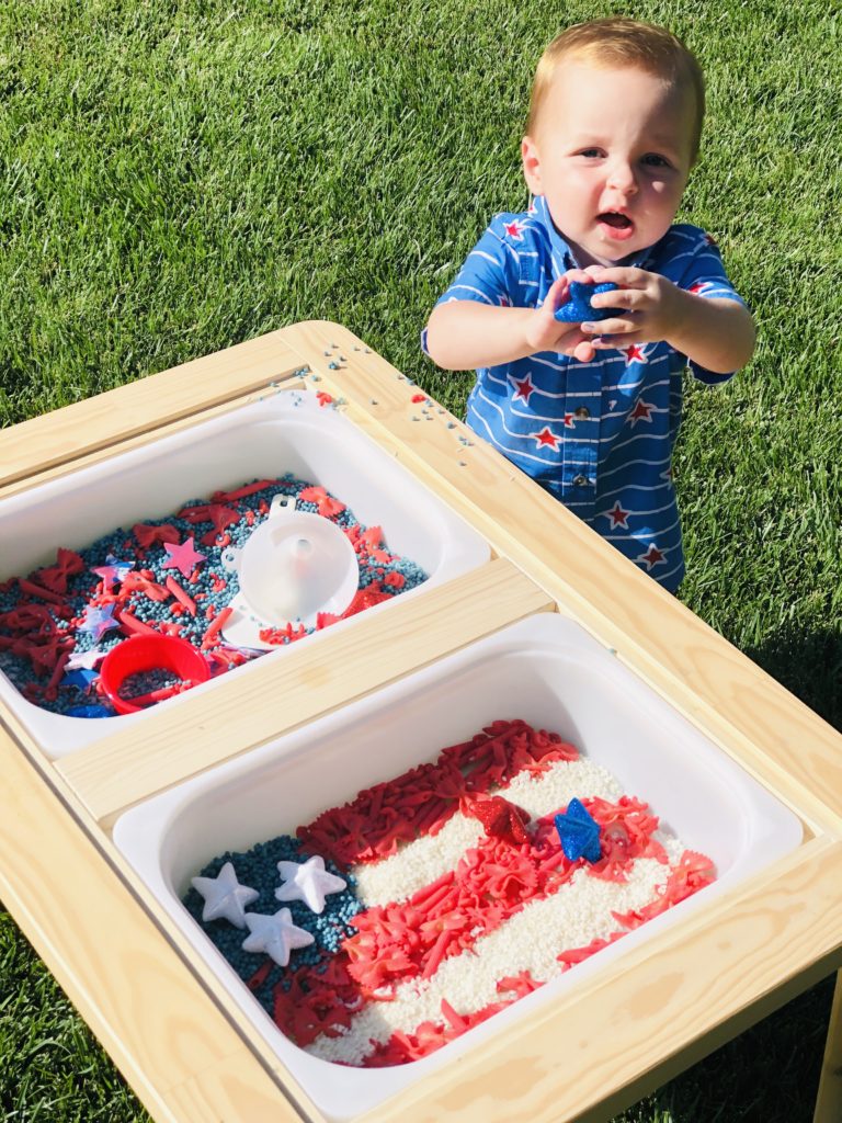 picture of a toddler playing in the sensory bin